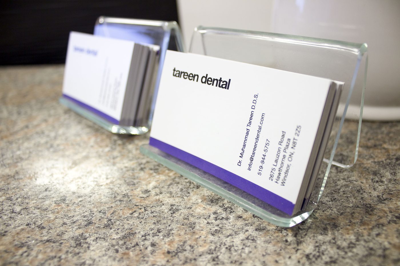 Tareen Dental business cards at the front desk